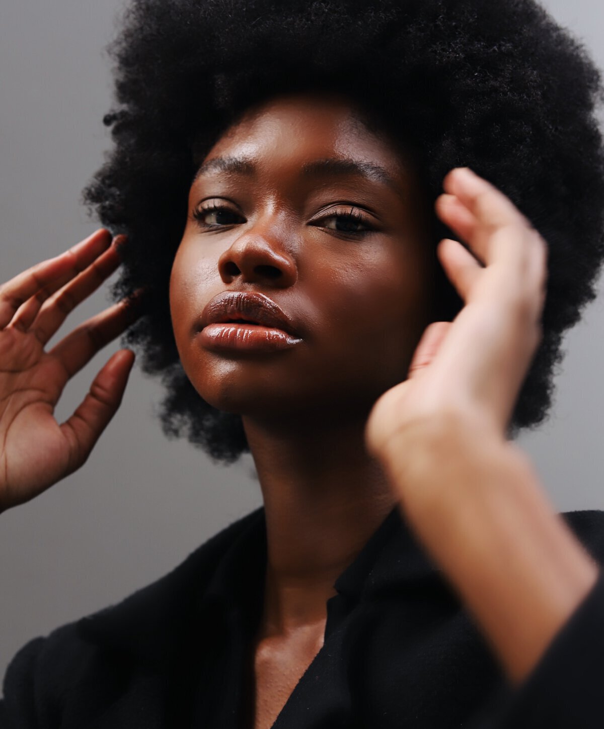 Woman posing hands near face
